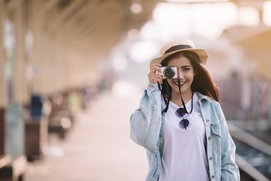 asian women be smile with camera travel holiday relaxation concept in thailand , vintage style. 