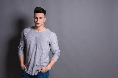 young handsome man studio portrait. boy style, trendy hipster in casual look with cool hairstyle, copy space