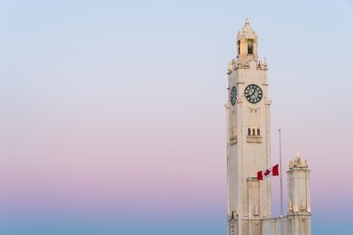 close up of clock tower in montreal at sunset
