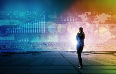 standing woman who looks various graphics of business. internet of things. information communication technology. digital transformation. abstract mixed media.