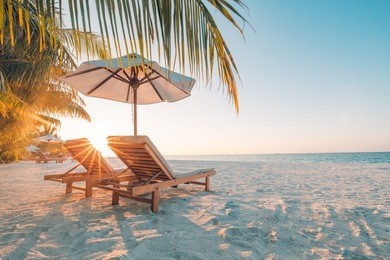 beautiful beach. chairs on the sandy beach near the sea. summer holiday and vacation concept. inspirational tropical beach. tranquil scenery, relaxing beach, tropical landscape design. moody landscape