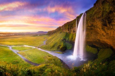 icelandic waterfall seljalandsfoss at sunset