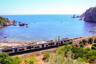 ocean with train alongside the coast taormina sicily italy september 2016 