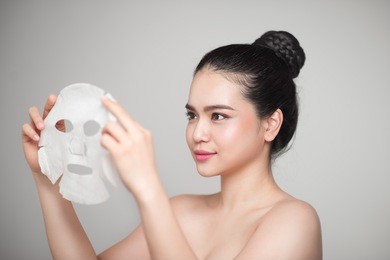 spa, healthcare. asian girl with a cosmetic mask.