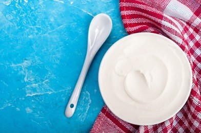 yogurt on blue background. dairy product. healthy food and diet concept. copy space. top view