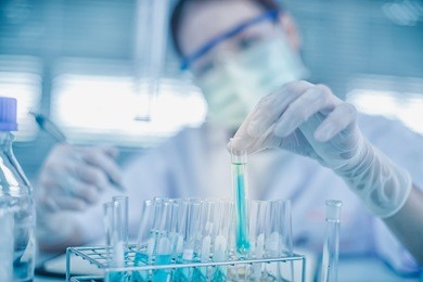 asian women scientist with test tube making research in clinical laboratory.science, chemistry, technology, biology and people concept