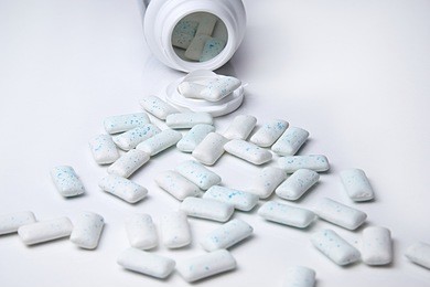 chewing gum spilled out on white background.