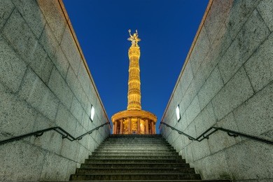the victory column in berlin at night seen from a different view