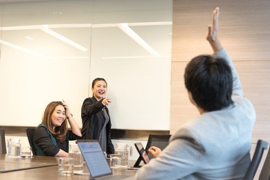  an internal meeting with an empty whiteboard.
