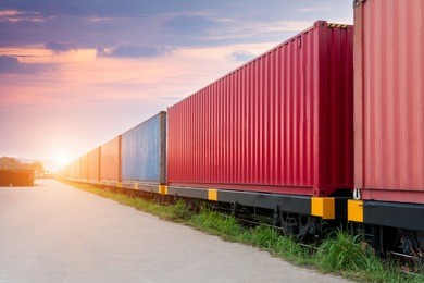 freight train with cargo containers, transport, shipping, import, export on the sky background