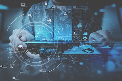 businessman hand working with modern digital tablet computer in modern office with virtual icon diagram