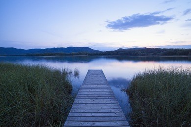 wooden bridge in the picturesque lake.