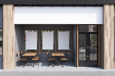 exterior of a cafe with gray walls, three posters hanging on them and wooden tables with chairs. 3d rendering, mock up