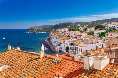 top view in cadaques, catalonia, spain near of barcelona. scenic old town with nice beach and clear blue water in bay. famous tourist destination in costa brava with salvador dali landmark