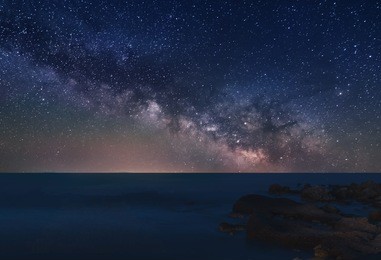 milky way over a beach in tabarca island, alicante, spain