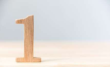 sign number one material wood on table, concept top winner success, copy space