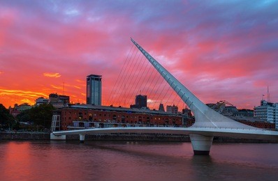 the district of puerto madero and the women's bridge in the sunset. buenos aires, argentina.