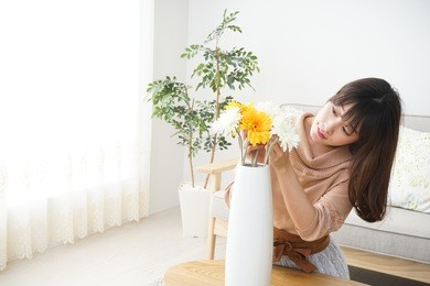 young woman having flowers