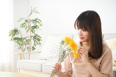 young woman having flowers