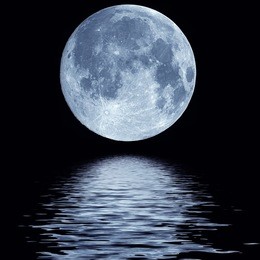full blue moon over cold night water