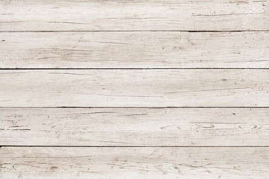 old weathered wood surface with long boards lined up. wooden planks on a wall or floor with grain and texture. light neutral tones. washed wood texture
