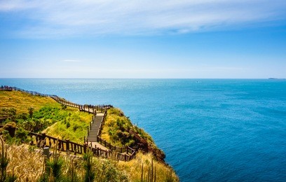 beautiful walkway with ocean view in songaksan mountain, jeju island.
