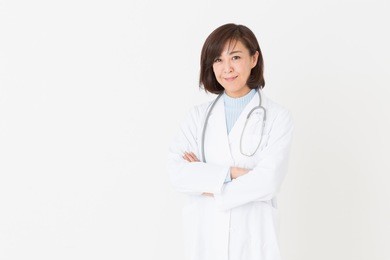 asian middle age woman in a white coat