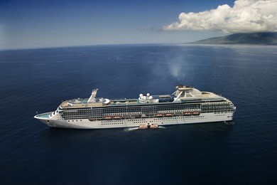 aerial view of large cruise ship in hawaiian waters.