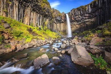 svartifoss waterfall surrounded by basalt columns in the south of iceland