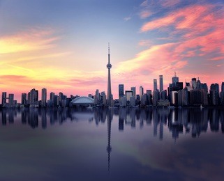 toronto skyline at night with a reflection in lake ontario, ontario, canada 