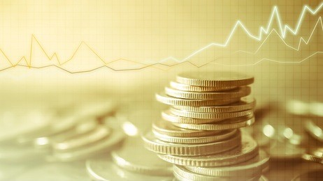 double exposure of grid, graph and rows of coins for finance and business concept