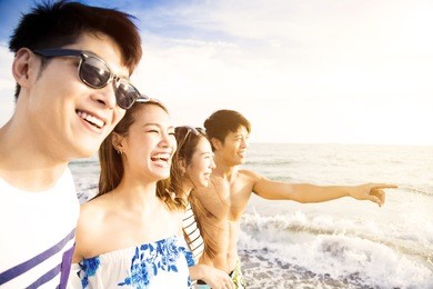 happy young group walking on the beach enjoy summer vacation