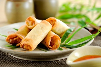 fried chinese spring rolls with sweet chili sauce.