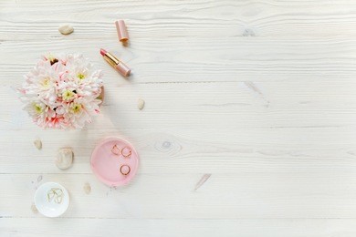 top view office desk. workspace with, laptop, bouquet roses, clipboard. women's fashion accessories isolated on white background. flat lay