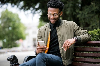 african american man using phone
