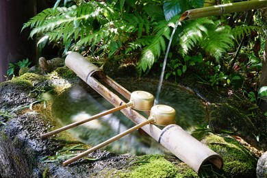 place the ritual washing of hands before visiting japanese temple.japanese temple wash hands area