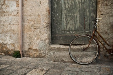 bicycle near the old door in small italian town 