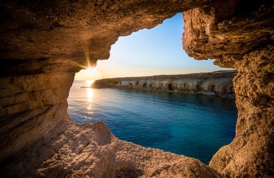 sunset at sea caves near ayia napa, cyprus, europe