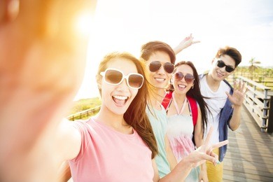 happy young group friends  taking selfie  on summer vacation