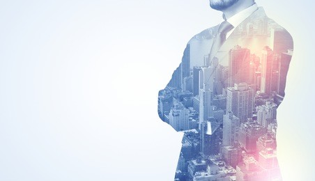 businessman in suit standing thinking with metropolis graphic 