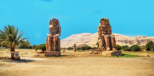 egypt. luxor. the colossi of memnon - two massive stone statues of pharaoh amenhotep iii
