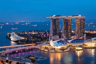 singapore cityscape at dusk. landscape of singapore business building around marina bay. modern high building in business district area at twilight.