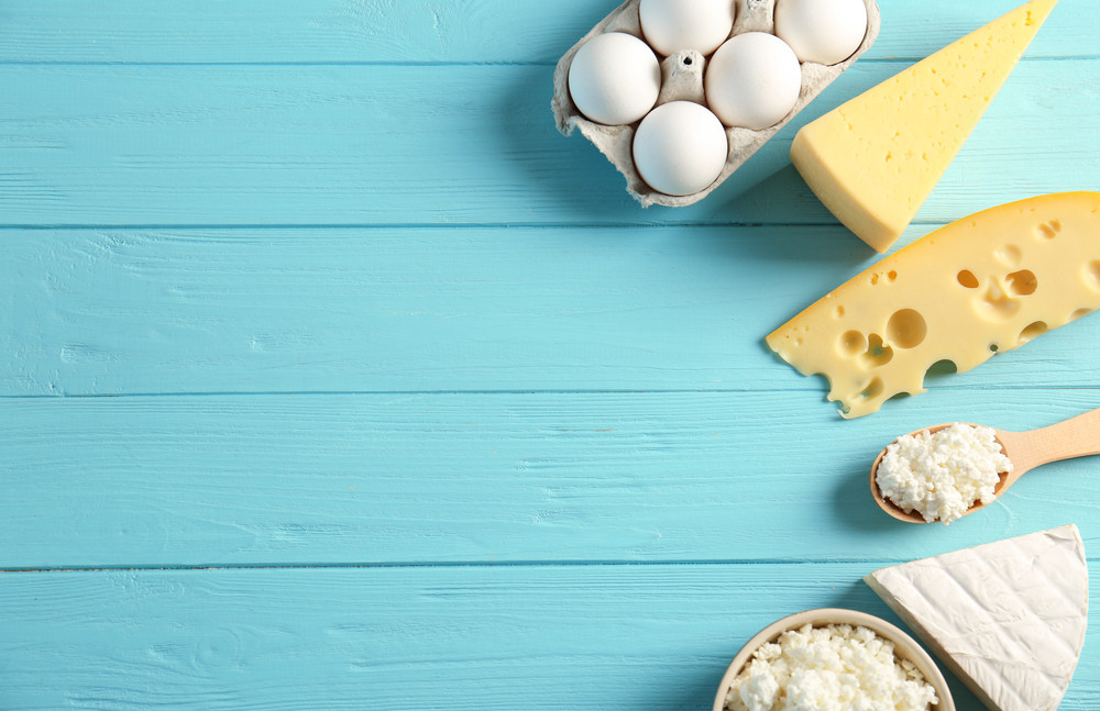 dairy products on wooden table, top view