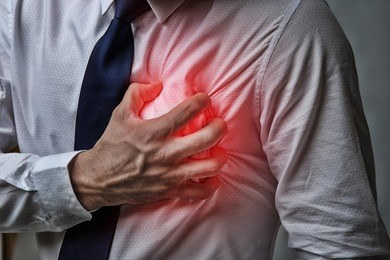 heart attack concept. man suffering from chest pain, closeup