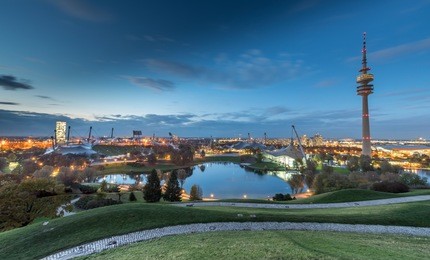 olympic park with olympic tower at night, munich, germany