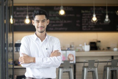young asian man with small business owner at restuarant, startup sme with woman working concept, 20-30 year old.
