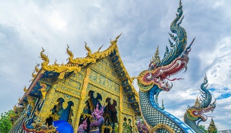 god of snake thai tradition in front of temple at wat rong sua ten,chiang rai,thailand