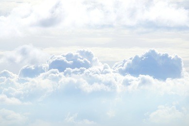 white sky and puffy clouds