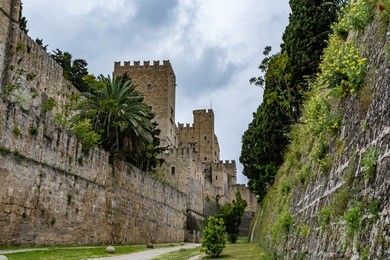 walls of rhodes old town and palace of the grand master, view from the moat, rhodes island, greece