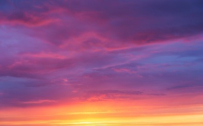 background of a bright sunset sky with clouds